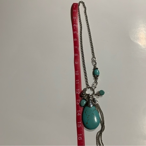 Silver tone and turquoise necklace with oversized pendant and charms. - Picture 6 of 8